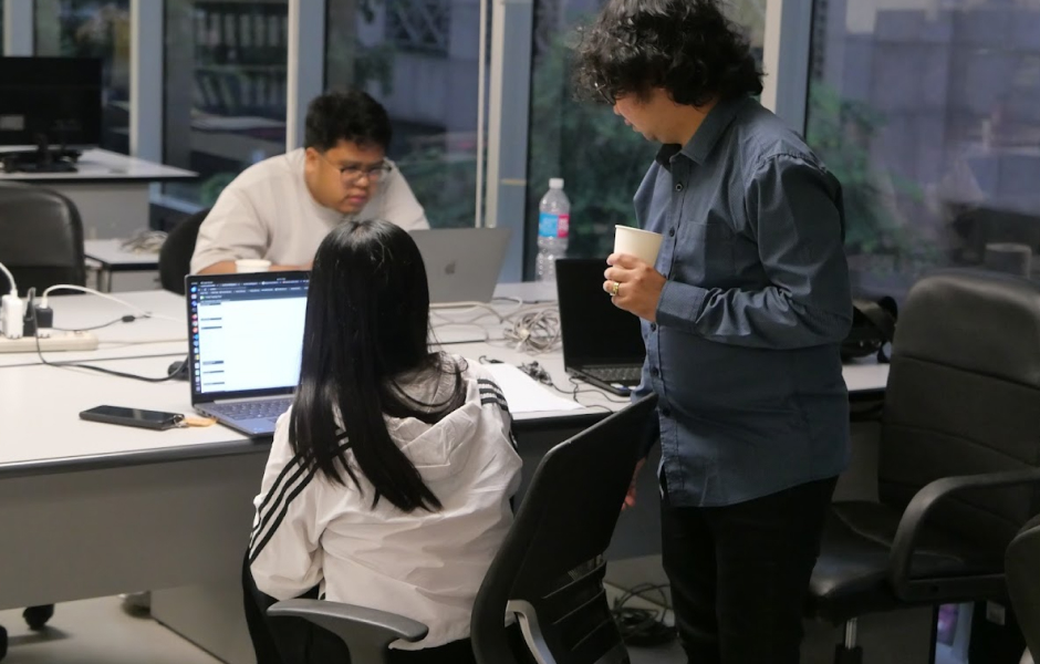 Skilled Filipino software developers collaborating on a project, showcasing Cambria's IT outsourcing strength