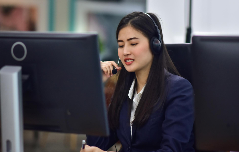 Customer service representative assisting a client over the phone, showcasing BPO outsourcing benefits